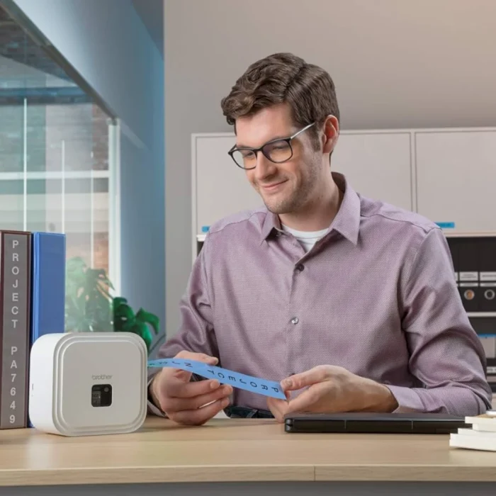 BROTHER เทปพิมพ์อักษรสีดำ พื้นน้ำเงิน ขนาด 36 มม. TZE-561